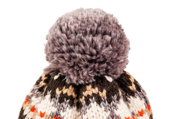 pompom of knitted hat on white