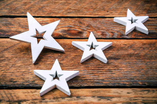 istock white stars on wooden background 965645416