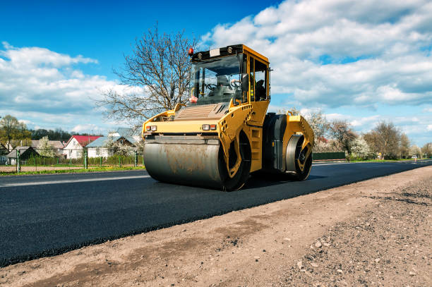 yellow road roller yellow road roller makes new road compactor photos stock pictures, royalty-free photos & images