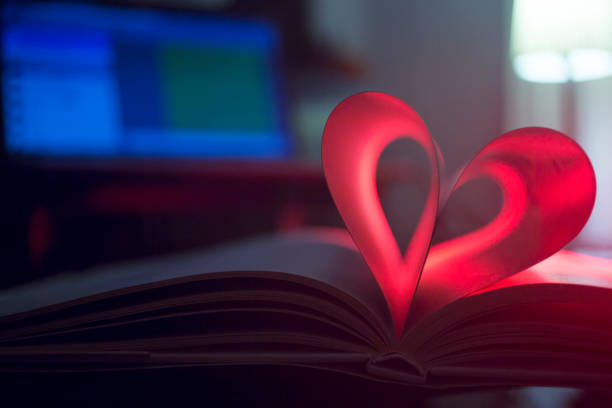 istock Romantic love heart shape made from pages of book. 965658694