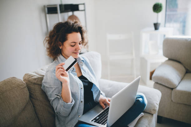 istock Woman using credit card to purchase merchandise on internet 965661204