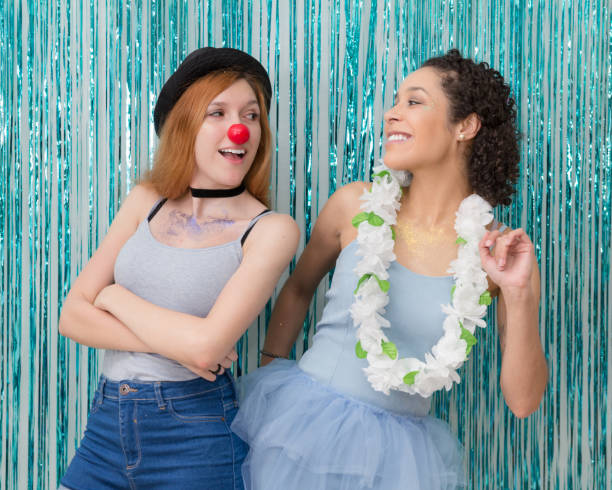istock Happy Friends Standing Against Wall With Decorations 965661494