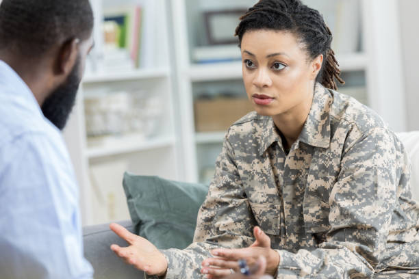 istock Army veteran with PTSD talks with therapist 965665490