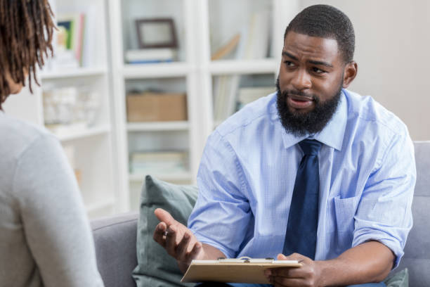 istock Mental health professional talks with female patient 965665536