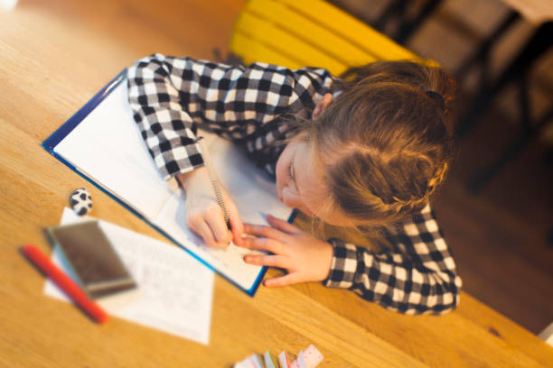 istock High Angle View Of Girl Studying At Table 965670104
