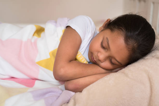 istock Girl Sleeping On Bed At Home 965674734
