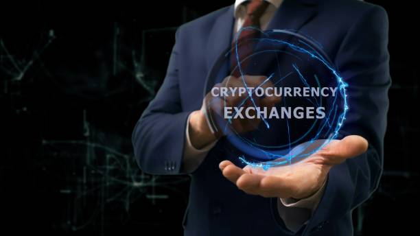 istock Businessman shows concept hologram Cryptocurrency exchange on his hand 965677642