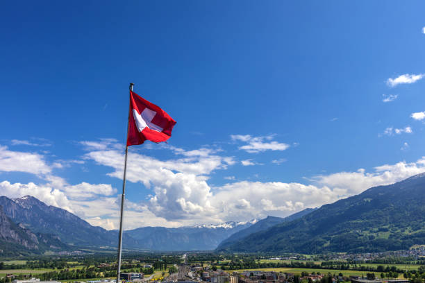 istock Swiss flag over the Alps in Switzerland 965677926
