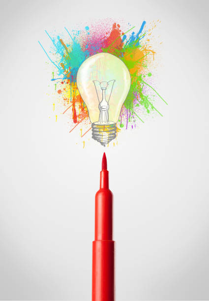 istock Felt pen close-up with colored paint splashes and lightbulb 965683648