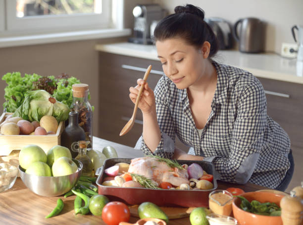 istock woman cooking in the kitchen 965685930
