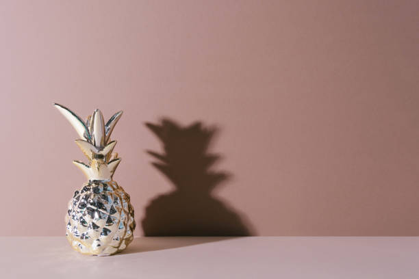 istock Tropical golden Pineapple on beige background 965688412