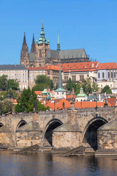 Prague, Czech Republic View towards the Mala Strana and Hradcany districts of Prague. On top of the hill is St Vitus Cathedral, in the foreground Charles Bridge. hradcany castle stock pictures, royalty-free photos & images