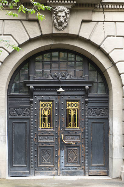 istock Ancient forged gates on the facade of the building 965711578