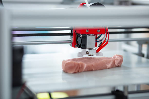 Close up of 3D printer recreating piece of meat Absolutely alike. The close up of a 3D printer recreating a piece of meat, imitating all the little details 3d printing photos stock pictures, royalty-free photos & images