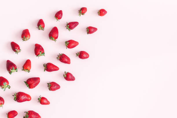 istock Strawberry on pastel pink background. Flat lay, top view 965729080