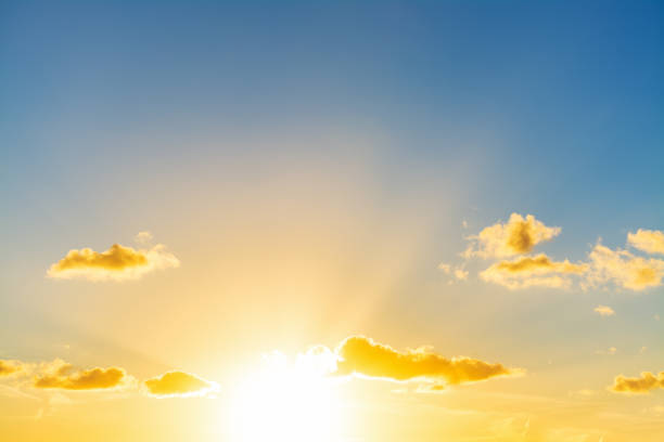istock Sun shining in the blue sky at sunset 965739908