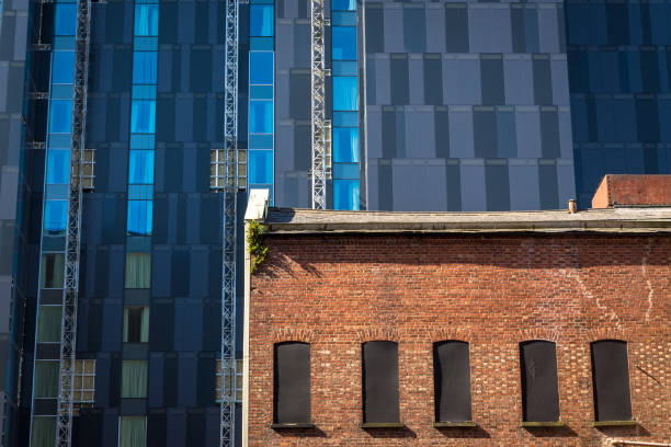 A building site where a skyscraper and old Victorian warehouse are being renovated