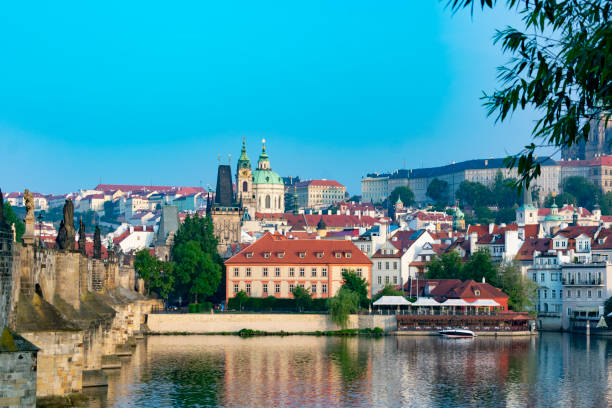 istock Prague, old buildings along the River over the Charles Bridge 965828998