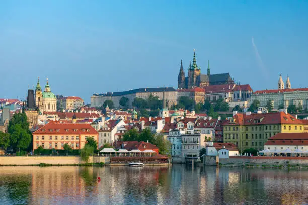 Photo of Prague, old buildings along the River over the Charles Bridge