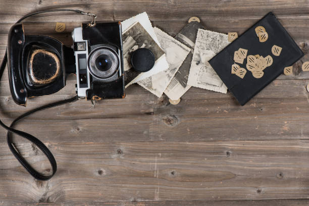 istock Retro camera and old fotos. 965851196