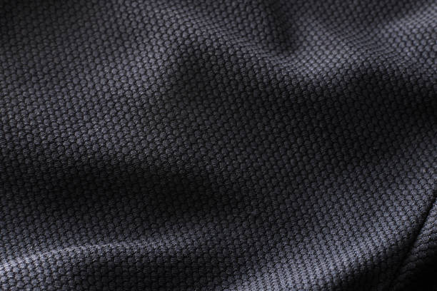 texture de tissu polyester close-up de chemise sport noire - jersey en matière textile photos et images de collection