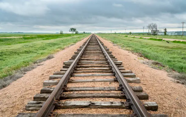 railroad tracks in a prairie of eastern Colorado - travel concept