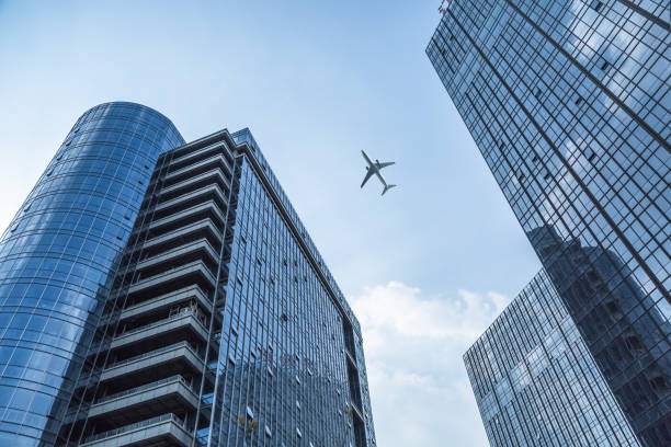 istock Plane flying over the skyscrapers 965887360