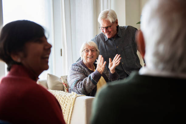 istock Senior people talking in a living room 965889556