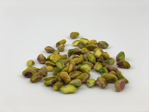 istock Large group of pistachios on white 965889948