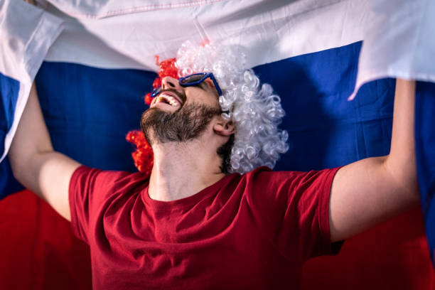 istock Russian fan celebrating at home 965890660
