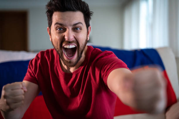 istock Russian fan celebrating at home 965890746