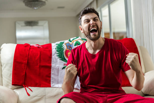 istock Peruvian fan celebrating at home 965891424