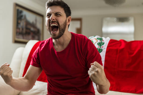 istock Peruvian fan celebrating at home 965891462
