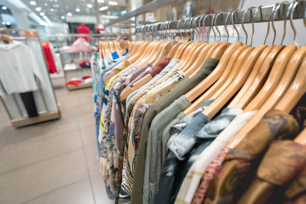 istock Beautiful clothes hanging at a clothing store 965902602