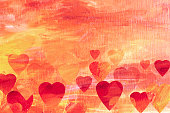 Hearts on yellow orange background with acrylic colors