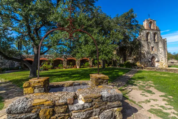 The Rustic and Historic Old West Spanish Mission Espada, established in 1690, San Antonio, Texas.  Showing water well.