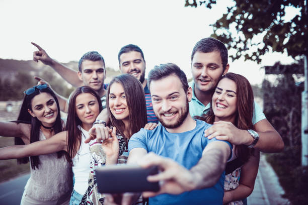 istock Crazy Friends Taking A Selfie On Vacation Walk 965948236