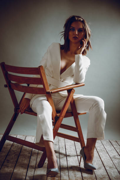 istock Sensual Female Posing on Chair At Studio 965959198