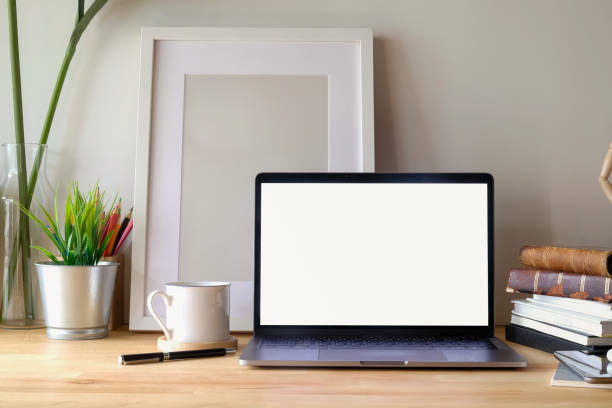 istock Contemporary workspace desk with mockup laptop and poster on desk. 965970442