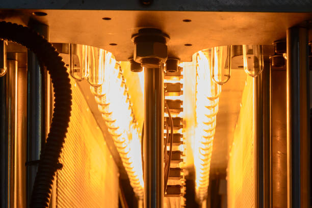 istock The preform shape of plastic bottle product in the heater for preheating process. 965971320