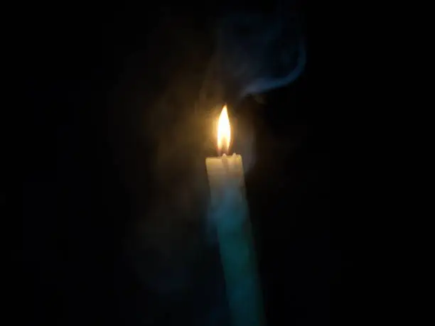 a candle in the smoke