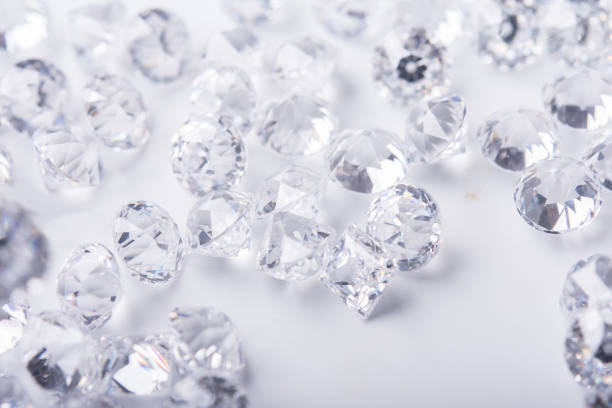 istock Diamond with tweezers and magnifier.Gemstone Beauty 965983990