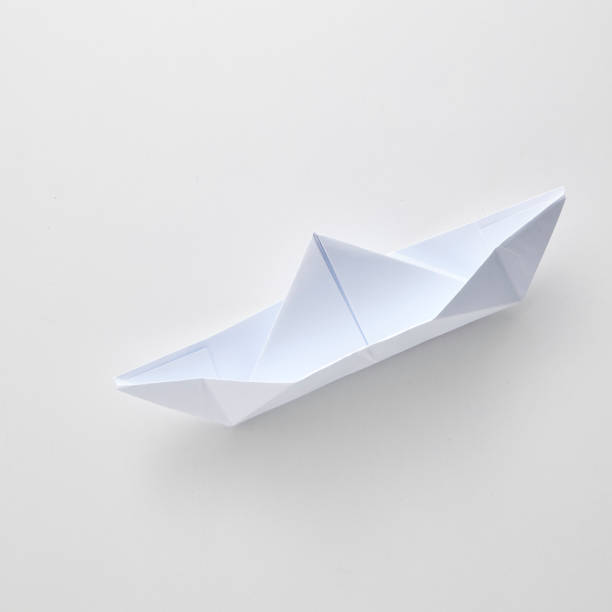 istock Origami paper ship isolated on white background. 965991918
