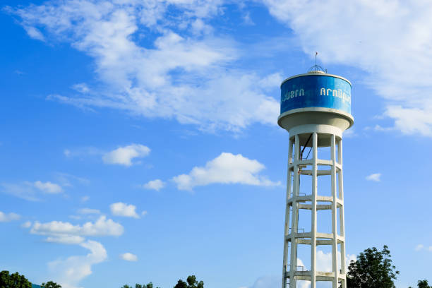 water tank concrete tower with the sky on background