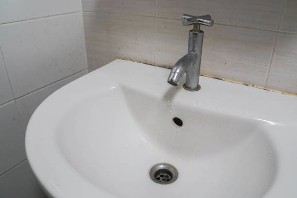 istock old vintage tap with ceramic washbasin in bathroom 966055896