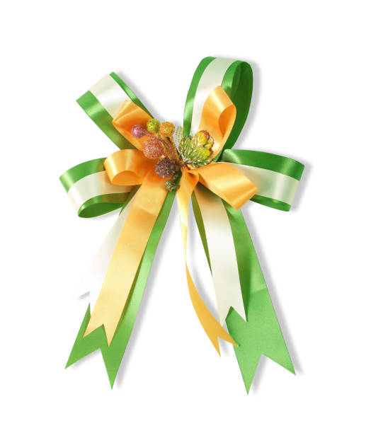 istock Decorative green & yellow color ribbon bow on white background 966066178