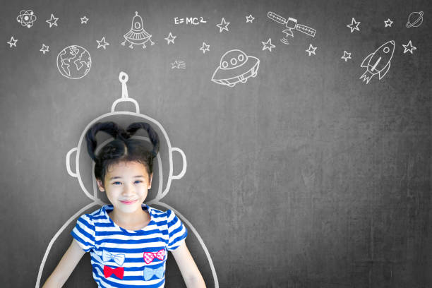 istock Science technology engineering maths STEM education concept with school girl kid in astronaut helmet and creative innovative knowledge learning doodle on teacher's chalkboard 966095476