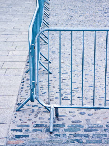 istock Metal barrier in a stone road - Image with copy space 966124342
