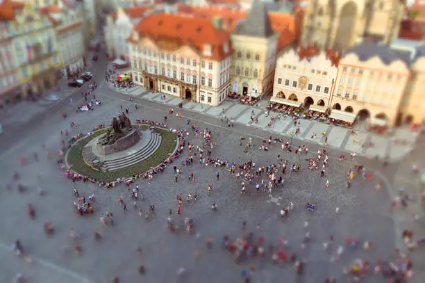 Aereal view of the historic Old Town Square in the Old Town quarter of Prague at sunset. Crowded famous square in Czech Republic. Tilt-shift effect