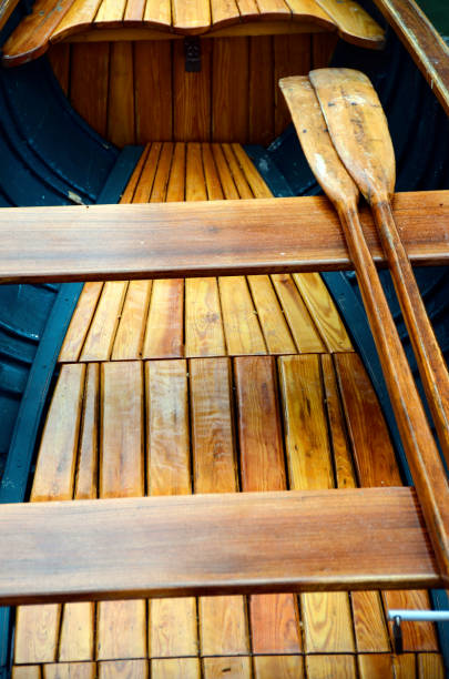 istock Wooden small boat and paddles 966141976
